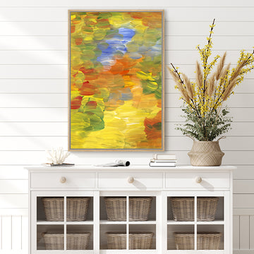 Abstract canvas art print in autumn colours of olive green, gold, and rust, in a country-style interior.