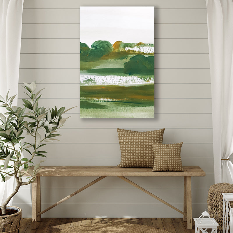 Art print that evokes the beauty of a rural landscape in dark green and olive hues, in a farmhouse-style interior.  
