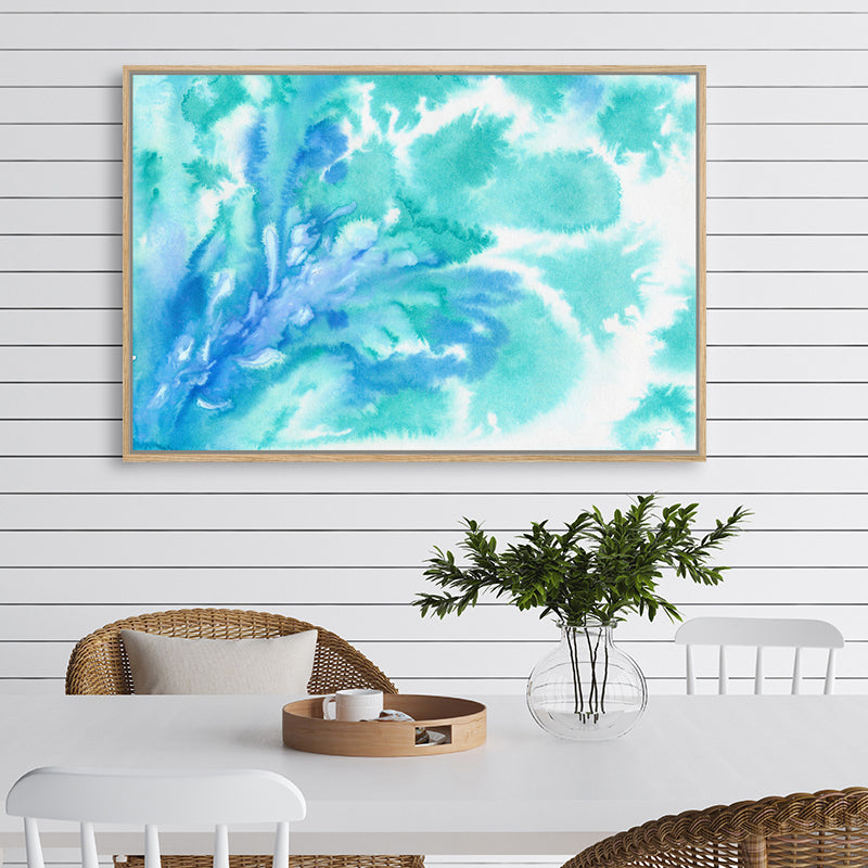 Aquamarine canvas art print with watercolour swirls that resemble the graceful movements of seawater, in a coastal-style room.
