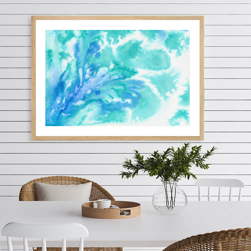 Aquamarine framed art print with watercolour swirls that resemble the graceful movements of seawater, in a coastal interior.