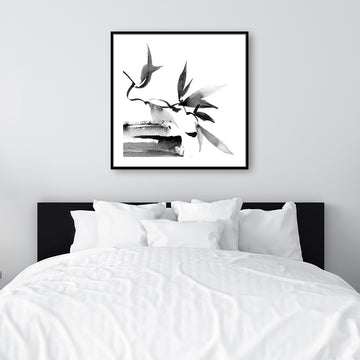 Black and white Japanese-style canvas art print of twigs and leaves, in a monochrome, minimalist interior.