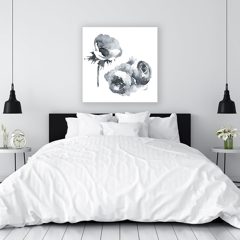 Black and white wall art print of flowers on a white background, displayed above a bed in a minimalist interior.