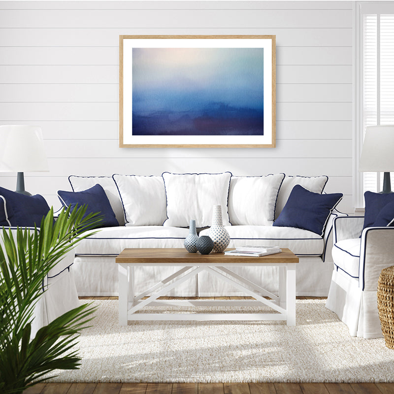 Navy blue framed art print of mountains beneath a velvety moonlit night sky, displayed in a Hamptons style living room.