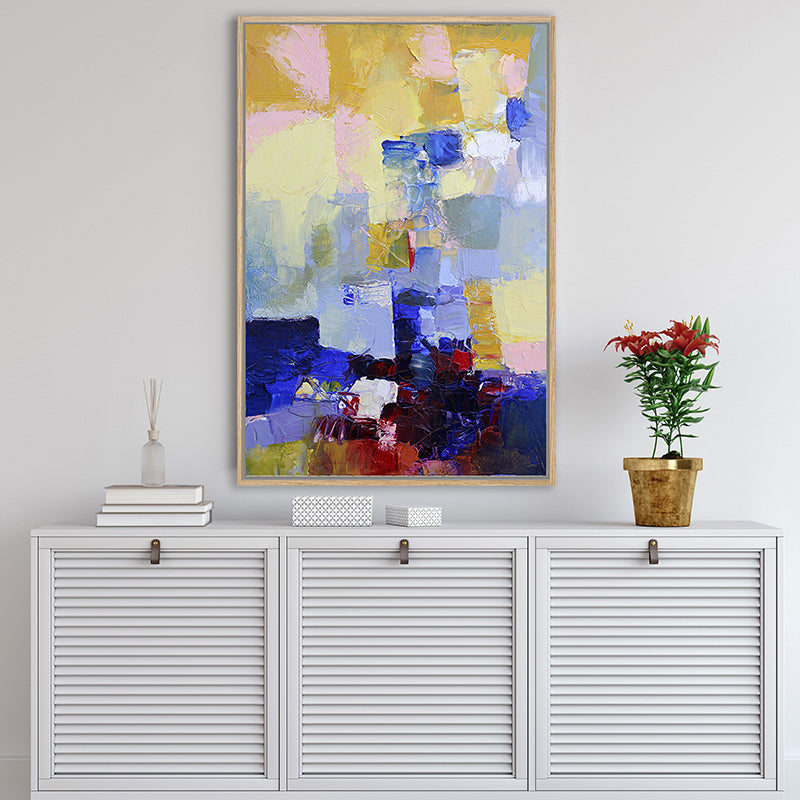 Canvas art print featuring rich navy blue and ruby red displayed above a white Hamptons-style sideboard.