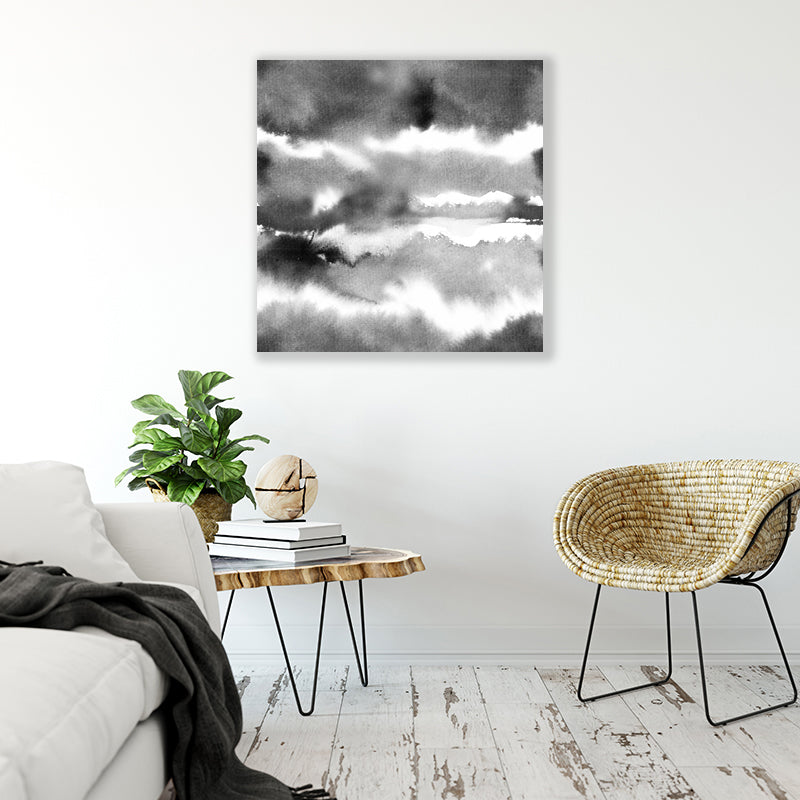 Abstract black and white canvas art print with watercolour washes resembling clouds in a bohemian living room.