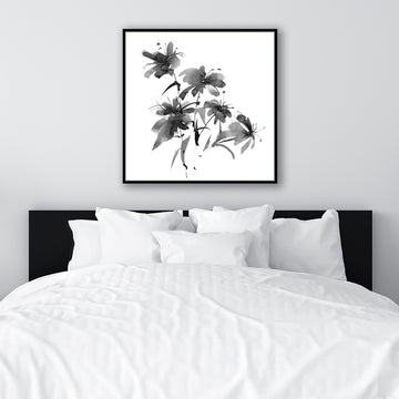 Black and white floral framed art print inspired by Japanese ink art displayed in a monochrome, minimalist  interior.