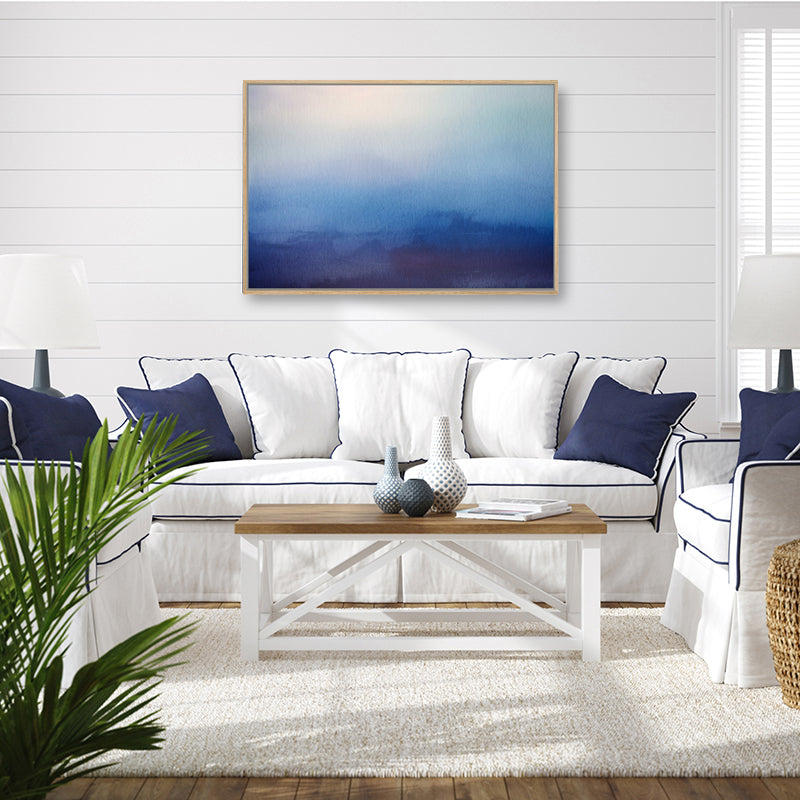 Navy blue canvas art print of mountains beneath a velvety moonlit night sky, displayed in a Hamptons style living room.