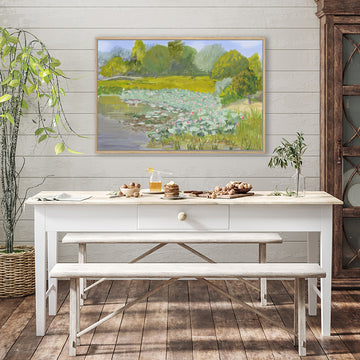 Canvas art print capturing the lush green landscape of a country estate displayed in a rustic farmhouse-style interior.
