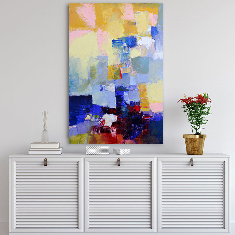 Art print featuring rich navy blue and ruby red displayed above a white Hamptons-style sideboard.