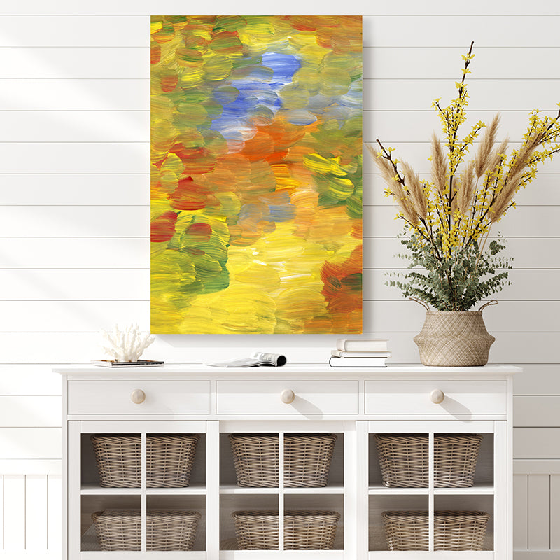 Abstract wall art print in autumn colours of olive green, gold, and rust, in a country-style interior.