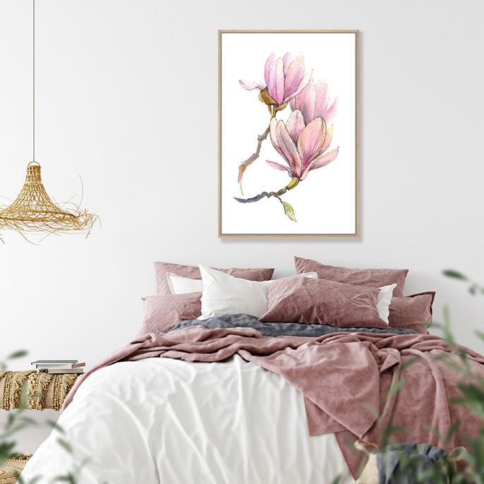Wall art print of pink magnolias on a white background in a boho bedroom.