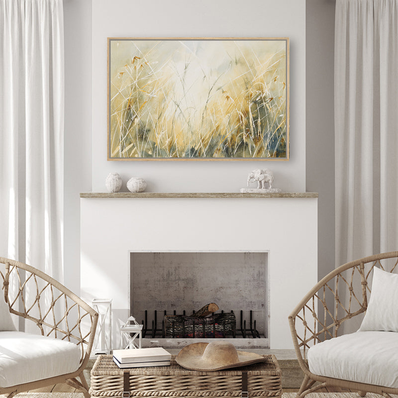 Framed canvas art print of sunlight filtering through dried grass, showcasing tan hues, in a beige living-room.  