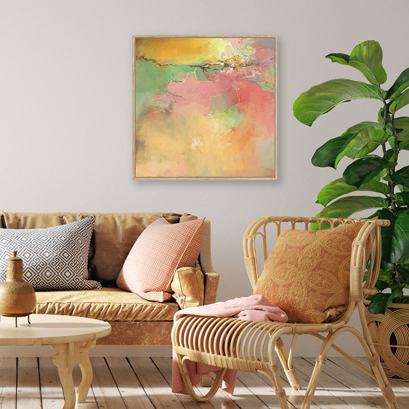 Abstract art print of amber sunset above pink and green pastures in bohemian living room.