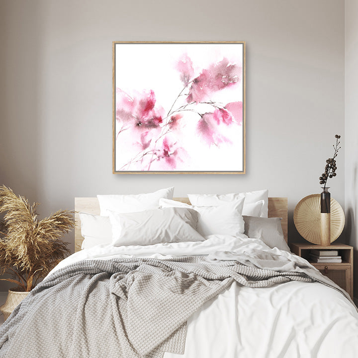 Abstract pink floral wall art print in a white and pale grey boho interior.
