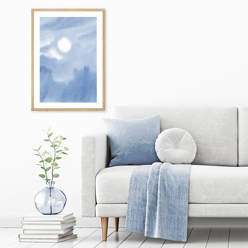 Framed watercolour art print of pastel blue sky in pale grey and white minimalist interior.